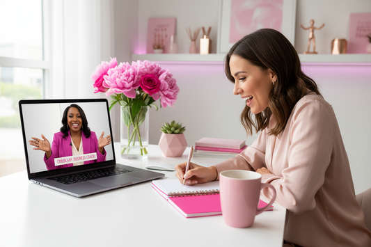 Create a high-quality, professional image of a private one-on-one business coaching call between two confident women entrepreneurs. One woman (the childcare coach) is speaking passionately on a laptop screen, while the other woman (the client) sits at her desk taking notes with focus and excitement. Show them smiling, collaborating, and connecting virtually — representing mentorship, growth, and empowerment.
Use the BuildHer brand colors throughout the scene:
 pink (#E90B68) — for accent elements l